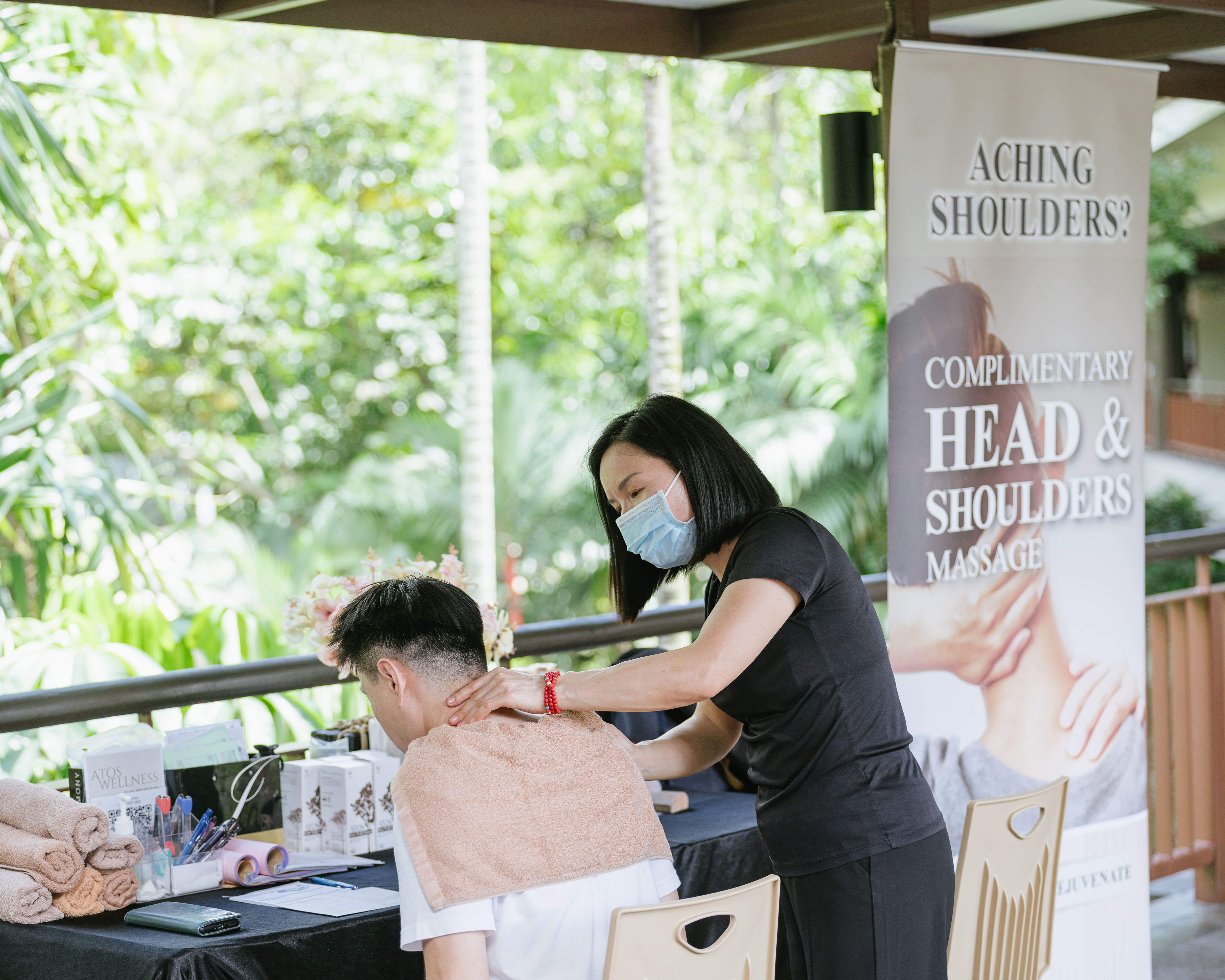 Head and shoulder massage at civil service club open house